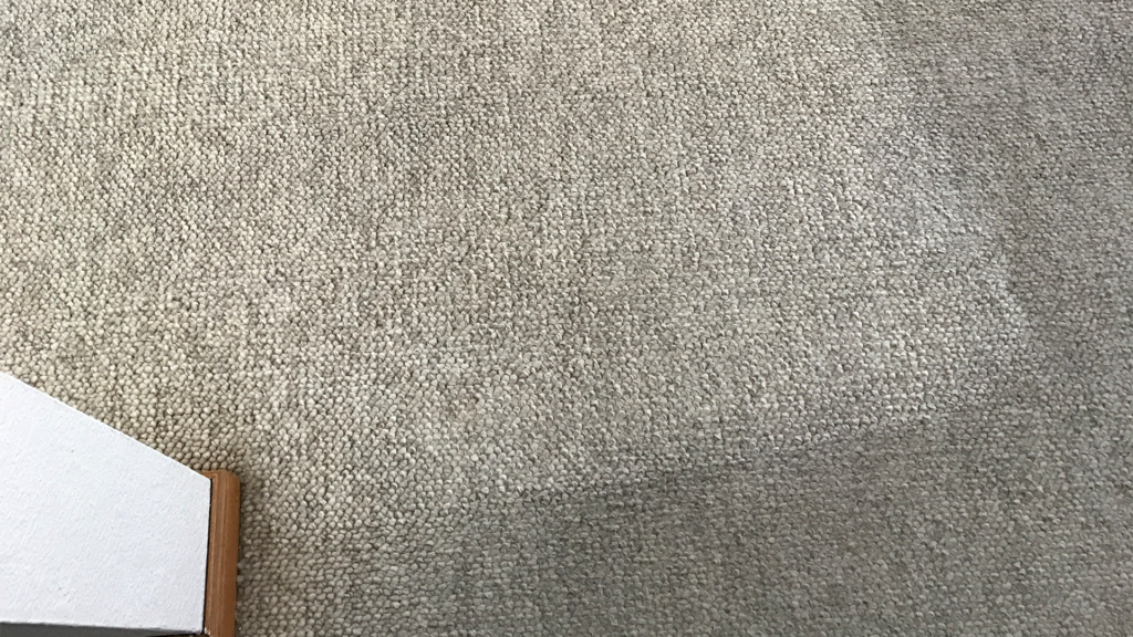 Photo of before and after residential carpet cleaning of Berber carpet