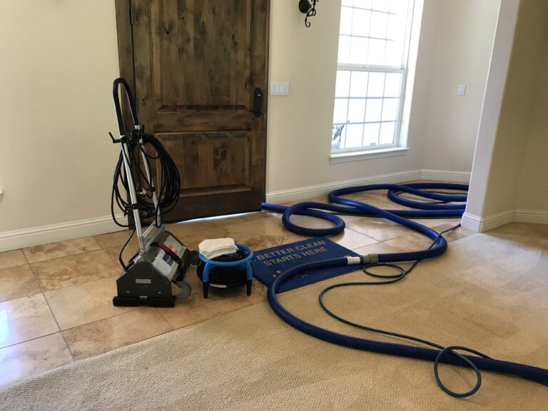 Photo of a foyer with carpet cleaning equipment setup