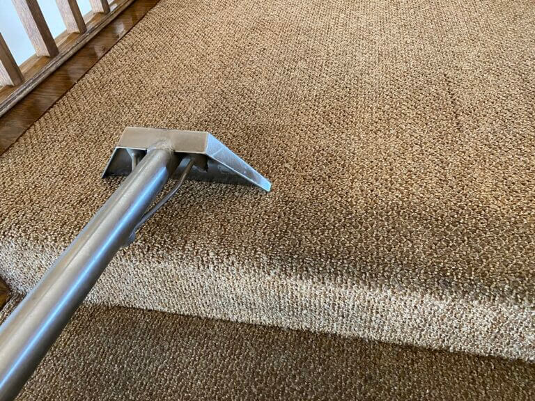 A before and after photo of residential berber hot water extraction carpet cleaning