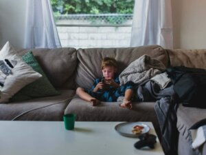 a child sitting on a sectional sofa